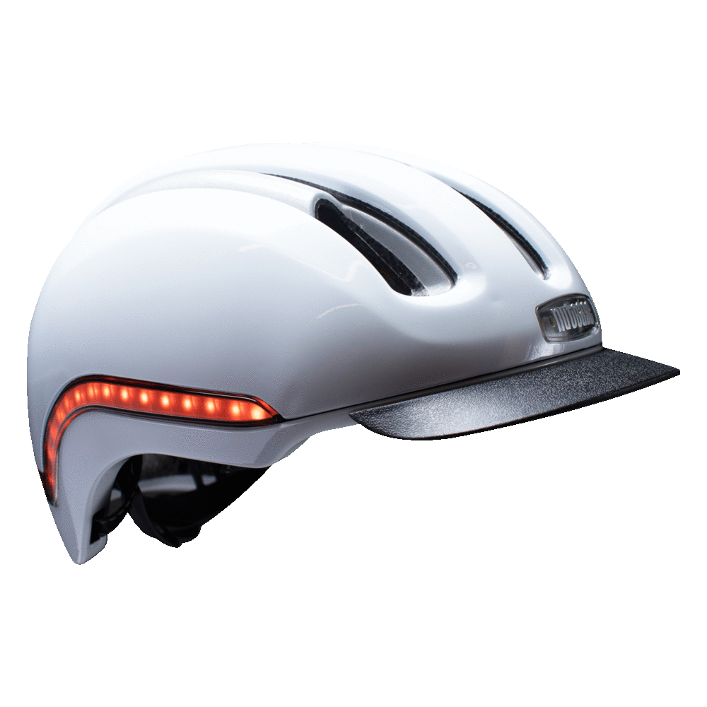 Nutcase Vio Blanco Gloss Adult helmet with MIPS, 200 lumens front LED headlight ,65 lumens side and rear LED lights, reflective print, magnetic buckle for easy on and off, dial adjustable for individualized fit and comfort, duo layer foam construction with denser outer layer and softer inner layer, and removable visor