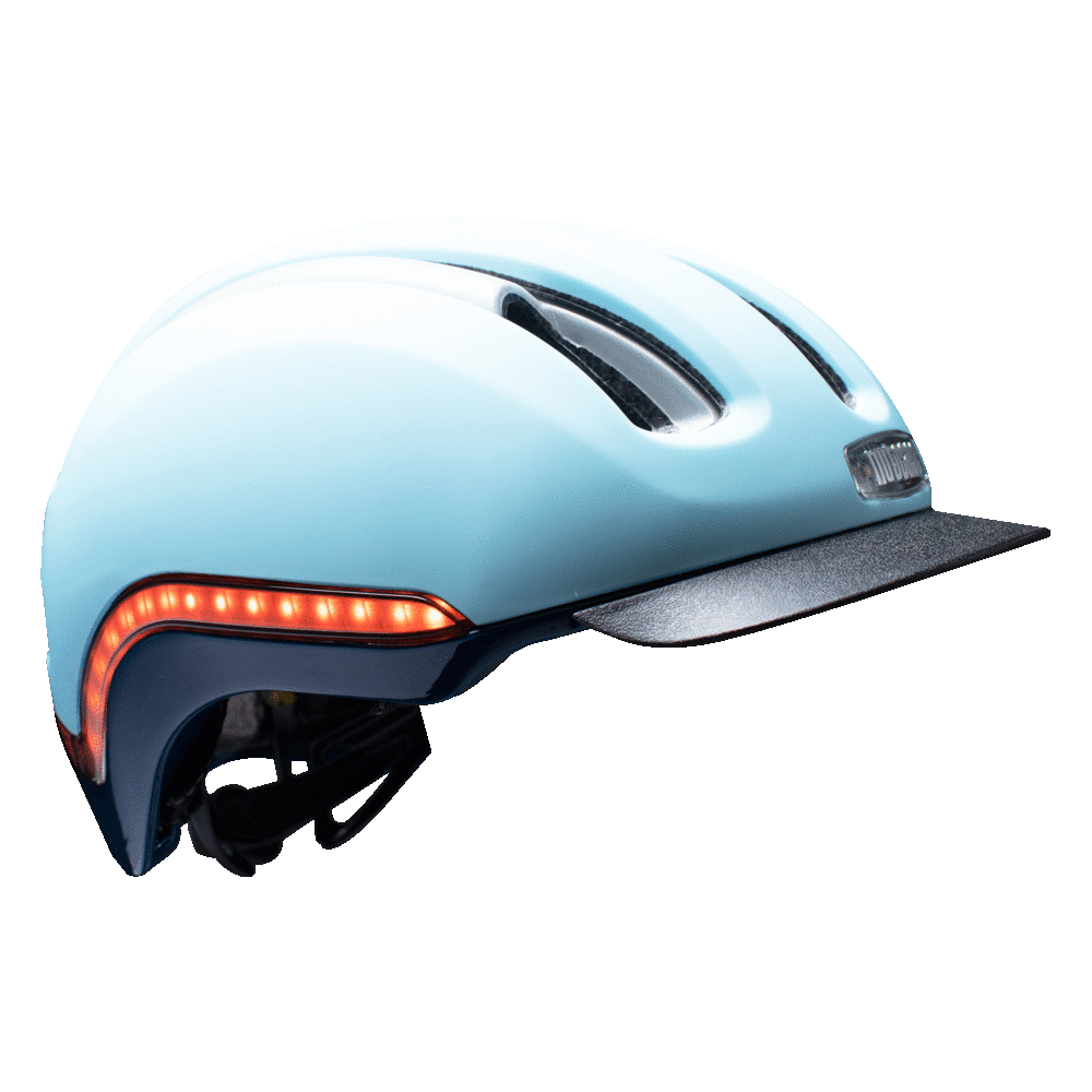 Nutcase Vio Sky Matte Adult helmet with MIPS, 200 lumens front LED headlight, 65 lumens side and rear LED lights, reflective print, magnetic buckle for easy on and off, dial adjustable for individualized fit and comfort, duo layer foam construction with denser outer layer and softer inner layer, and removable visor